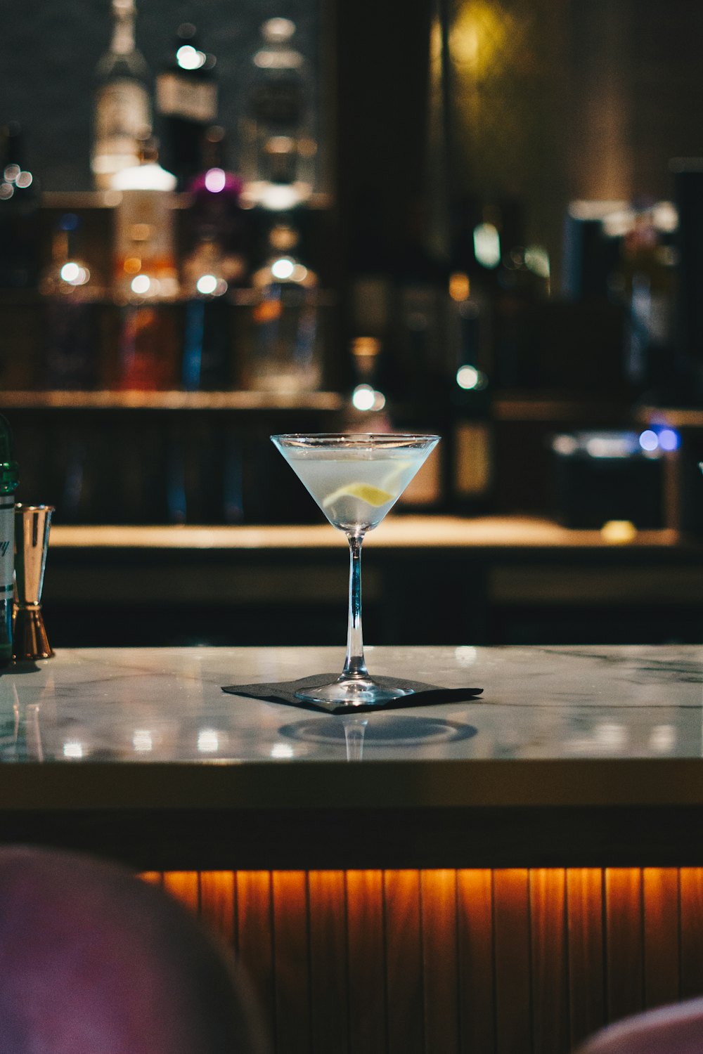 A martini on a polished bar